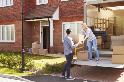 Local furniture removals team handling heavy household items in Watford