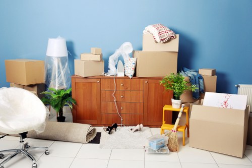Professional Watford movers unloading household items at a new property