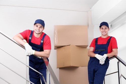 Packed moving boxes and furniture ready for transport