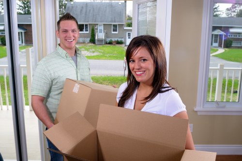 Professional movers loading furniture into a van