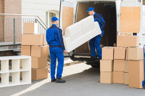 Same day removals team loading boxes in Watford