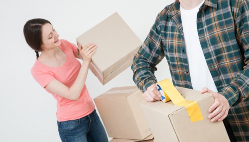 Free quote policy for Movers Watford illustrated with packed boxes