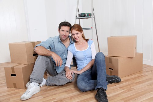 Staff using PPE during a professional move in Watford