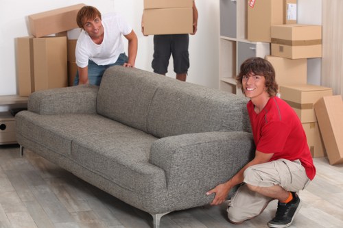 Staff assessing lifting risks before moving furniture
