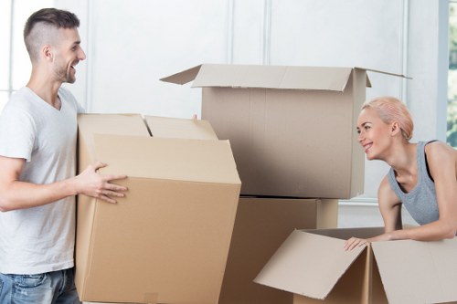 Loading furniture into a removal truck in Watford