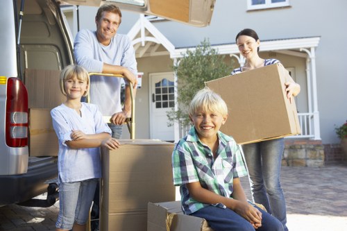 Professional movers loading household furniture in Watford