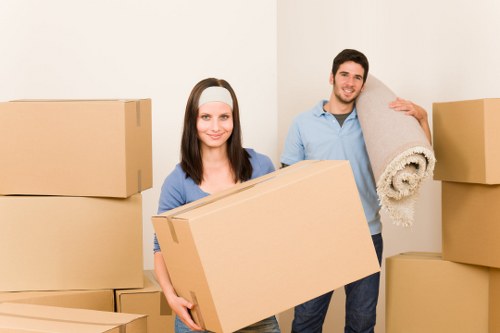 Packed moving boxes and furniture ready for removals in Watford