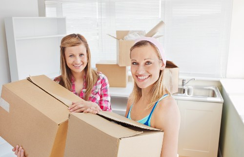 Professional furniture pick-up in Watford handling a bed frame and wardrobe