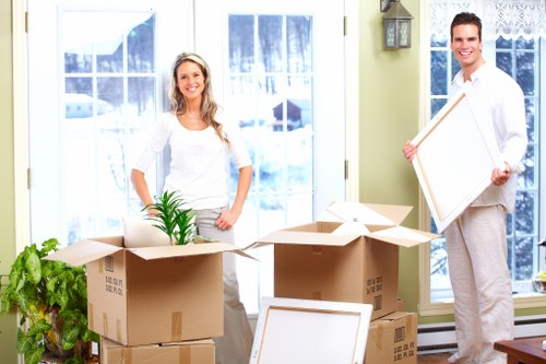 Local house removalists in Watford preparing boxes and furniture for relocation