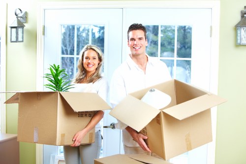 Packed boxes and furniture ready for a flat removal in Watford